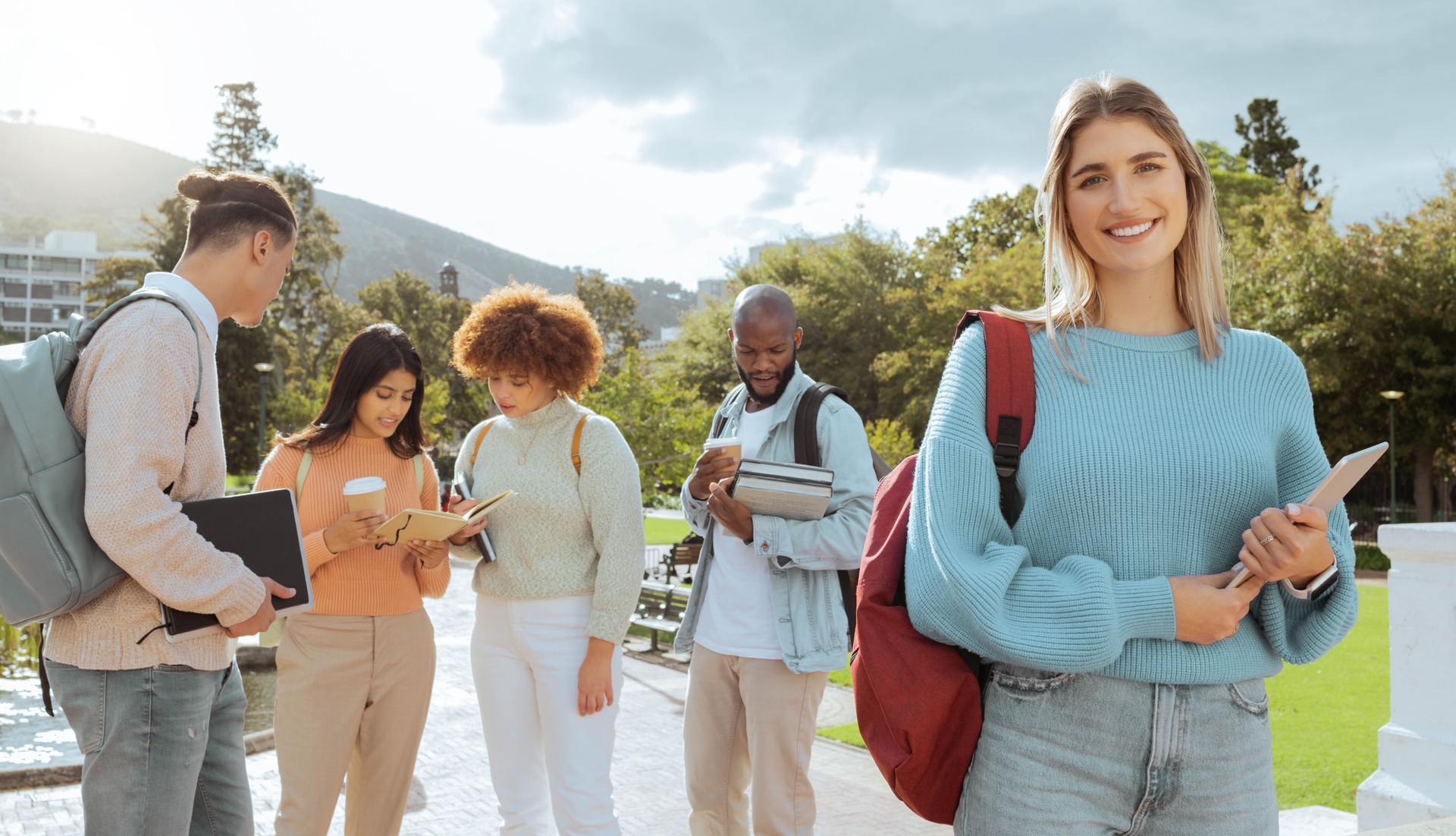 Campus, university and woman portrait in study group, learning community and happy education goals. Young gen z person, social students or youth smile for scholarship, philosophy or history planning